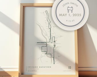 May include: A framed vertical print featuring a map of the Chicago Marathon route in black lines on a cream background. The text reads CHICAGO MARATHON, 26.2 mi (42.195 km). A circular badge displays JOHN SMITH, MAY 1, 2025, and 4:12:53.