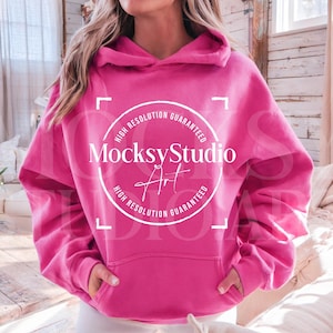 May include: A bright pink hoodie with a white circle logo that says "MocksyStudio Art" and "High Resolution Guaranteed".