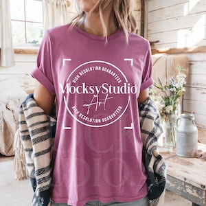 May include: A mauve t-shirt with a white circle graphic that says "MocksyStudio Art" and "High Resolution Guaranteed".