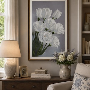 May include: A framed wall art print featuring a cluster of white flowers with visible water droplets on the petals, set against a soft gray background. The artwork is encased in a thin gold frame with a white mat border.
