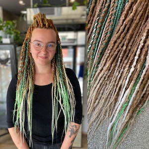 May include: A woman with long, colorful dreadlocks. The dreadlocks are a mix of brown, green, and blonde, with some styled up and others hanging down. The woman is wearing a black long-sleeved shirt and glasses. A close-up of the dreadlocks is on the right.
