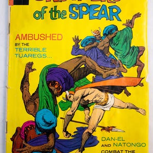 May include: A vintage Brothers of the Spear comic book with a bright yellow cover. The illustration depicts figures in combat wearing colorful robes and headgear. Text includes the title, the price of 25 cents, and the story subtitle Harvest of Fear.