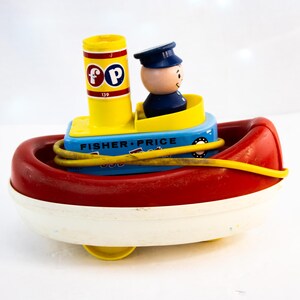 フィッシャープライス　ヴィンテージ　TUGGY TOOTER トイストーリー Vintage 1967 Fisher-Price Tuggy Tooter Pull Toy | eBay
