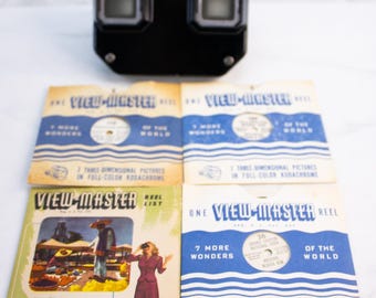 Videocamera Sawyers View-Master modello C in bachelite del 1948 + 3 rullini con immagini di New York, Grand Canyon e Yellowstone + catalogo