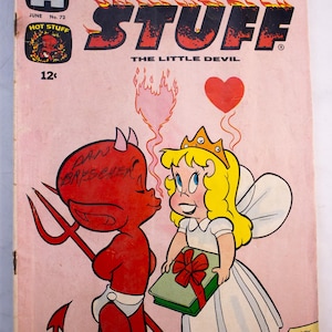 May include: A vintage Harvey Comics Hot Stuff The Little Devil comic book, issue number 72, dated June. The cover features a red devil character and a blonde fairy holding a gift, with the text Hot Stuff The Little Devil and a 12 cent price mark.