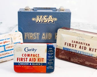 Kit de primeros auxilios vintage MSA Curity Bauer Negro Johnson Johnson Caja metálica