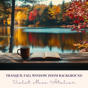 May include: A serene autumn scene through a window. A brown mug and an open book rest on a wooden sill, with a lake and colorful fall foliage in the background. The text reads "Tranquil Fall Window Zoom Background" and "Violet Muse Atelier".