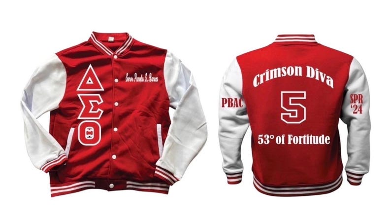 May include: A red and white letterman jacket with the Greek letters Delta, Sigma, and Theta on the front. The back of the jacket features the words "Crimson Diva", the number 5, and "53&deg; of Fortitude".