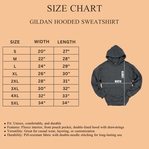 May include: Size chart for a Gildan hooded sweatshirt. The chart shows sizes S to 5XL with corresponding width and length measurements in inches. Features include a fleece interior, front pouch pocket, and double-lined hood. The sweatshirt is shown in a dark gray color.