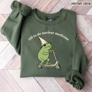 May include: A set of three ceramic mugs with a speckled, matte finish. The mugs are in shades of cream, light brown, and dark brown. Each mug has a simple, minimalist design, perfect for coffee or tea.