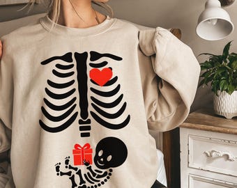 Skeleton Christmas Maternity Sweatshirt Christmas Skeleton Pregnant Crewneck Funny Pregnancy Announcement 2025 Sweater New Mama To Be Gift