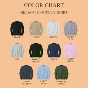 May include: Color chart of Gildan 18000 sweatshirts in various colors, including black, sand, white, sport grey, ash, forest green, navy, light pink, dark heather, light blue, and military green. The text "COLOR CHART" and "GILDAN 18000 SWEATSHIRT" are at the top.