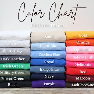 May include: Color chart of Gildan 18000 apparel in various colors, including white, black, and navy. Other colors include light blue, orange, and red. The text "Color Chart" is written in cursive at the top of the image.