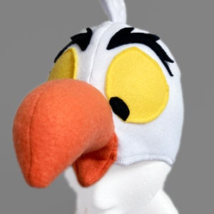 Gorro de gaviota. Grandes ojos amarillos. Para bebés y adultos. Pájaro marino. Polar.