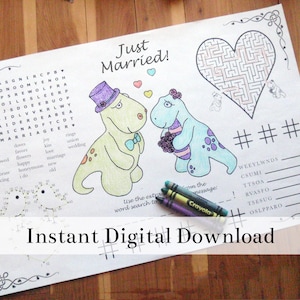 Könnte beinhalten: Eine druckbare Malvorlage mit einem Hochzeit-Wortsuchspiel, einem Labyrinth und einer Punkte-Verbindungs-Aktivität. Die Seite zeigt zwei Dinosaurier in Hochzeitskleidung mit dem Text "Just Married!" oben.