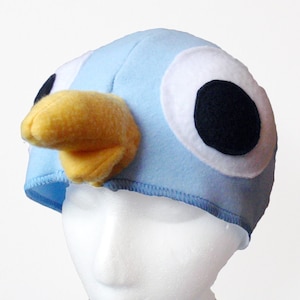Sombrero de paloma de ojos grandes. Pájaro azul claro.