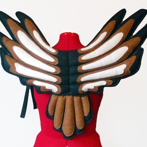 Falcon Wings. Keeps shape. Eagle, Hawk Boy, Peregrine Falcon Girl.