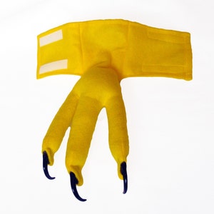 May include: Yellow felt claw costume with three claws and a headband with velcro closure.