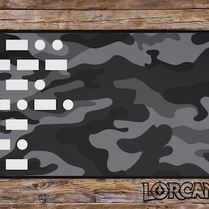 May include: A black and grey camouflage mouse mat with white circles and rectangles. The mouse mat has a design of a grid with circles and rectangles in each square.
