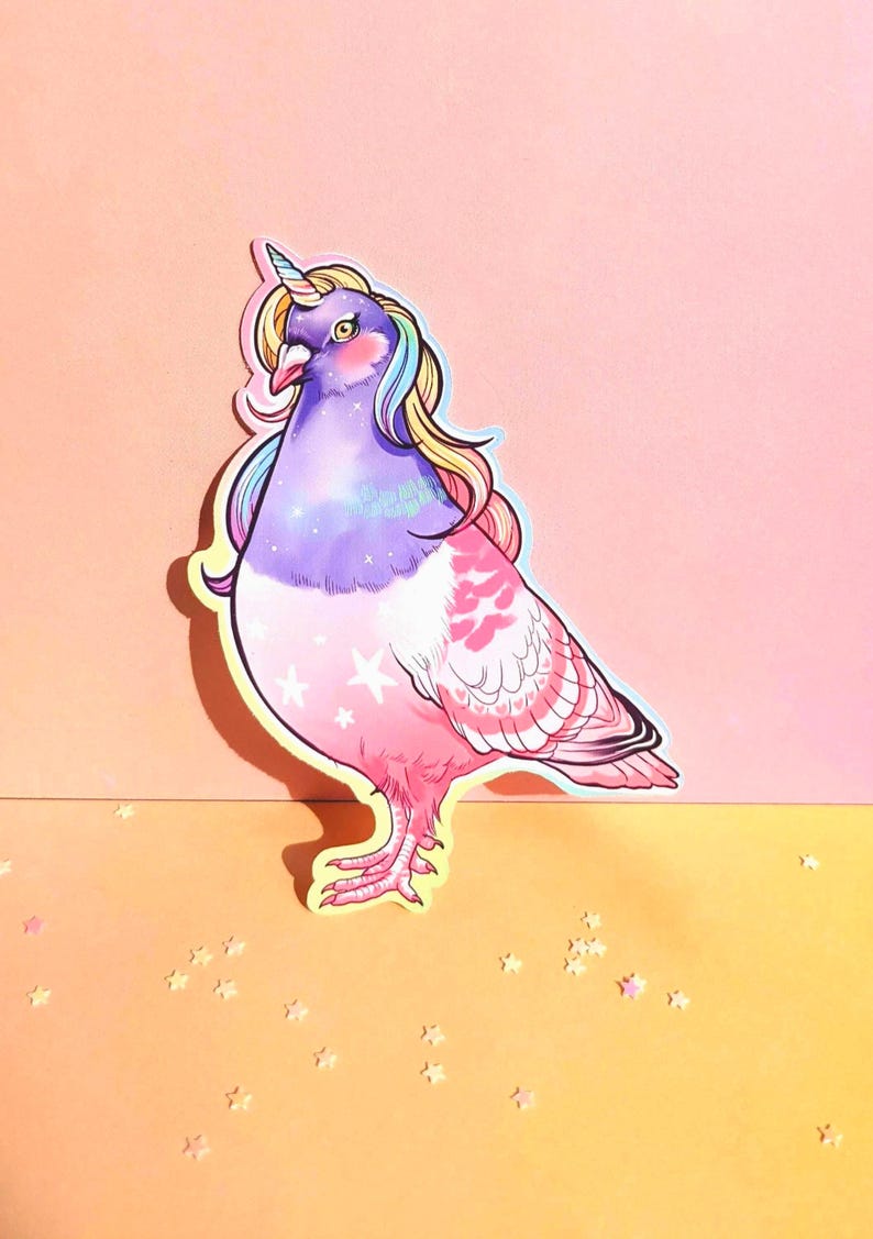 May include: A whimsical sticker featuring a pigeon with a unicorn horn and rainbow-colored mane. The bird is primarily purple and pink, with white stars on its chest and a yellow outline. The background is a gradient of pink and yellow.
