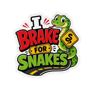May include: A die-cut sticker featuring a cartoon green snake coiled around a yellow road sign with a snake icon. The text reads I BRAKE FOR SNAKES in bold red and green lettering. A black road with yellow dashed lines curves underneath the design.