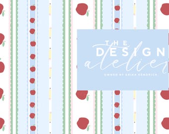 May include: A repeating pattern featuring red apples, yellow pencils, and light blue scalloped stripes on a white background. The text "THE DESIGN atelier" is displayed on a light blue rectangle, with "OWNED BY ERIKA KENDRICK" below.