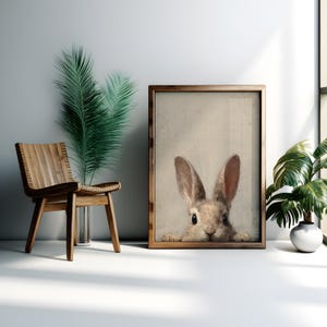 Cute brown rabbit wall art for nursery — charming vintage portrait with large eyes and soft hues perfect for cozy decor.