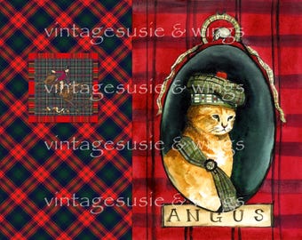May include: A watercolor painting of a ginger cat wearing a green and blue plaid tam o' shanter. The cat is sitting in a black oval frame with a red and green plaid background. The text "ANGUS" is written in gold below the frame.