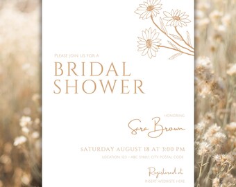 May include: A white invitation card with the text "BRIDAL SHOWER" in a serif font. The card includes the name "Sara Brown", event details, and floral illustrations in a gold color. The background is a blurred image of dried plants.