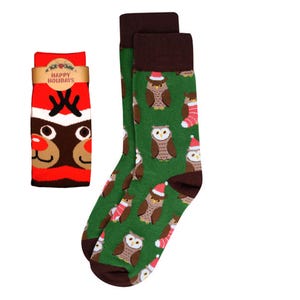 May include: A pair of green Christmas socks with brown owls wearing Santa hats and red and white striped stockings. A red sock with a reindeer face and the words "Happy Holidays" is also shown.
