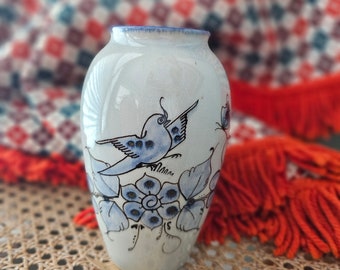 Vintage pottery vase with painted bluebird