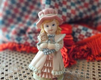 Porcelain Girl Figurine by Homco #1419 - Girl Holding her Doll - Home Interiors Girl Statue