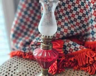 Vintage small brass and red glass oil lamp