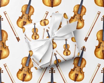 Papel de regalo con diseño de violín, ideal para músicos.