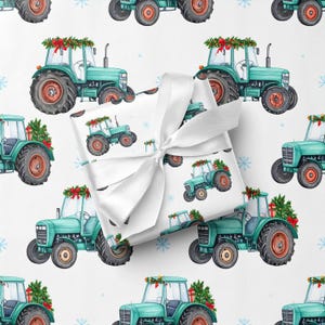 May include: White wrapping paper with a pattern of teal tractors decorated with Christmas wreaths and small trees. A wrapped gift with a white ribbon is in the center of the image.