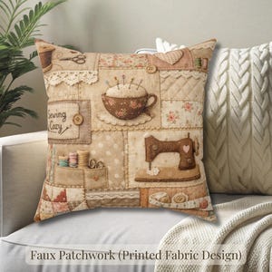 May include: A decorative square pillow with a patchwork design featuring sewing-themed elements. The pillow has a beige background with images of a sewing machine, spools of thread, and the text "Sewing Cozy". A second pillow with a cable knit design is also visible.