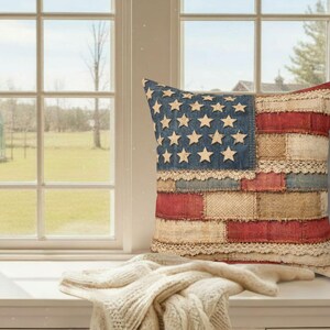 Vintage style American flag patchwork pillow on bright window bench with soft farmhouse styling