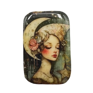 May include: Rectangular decorative tray featuring a vintage illustration of a woman with closed eyes, adorned with a crescent moon headdress and floral accents. The color palette includes soft pinks, greens, and creams, with a star-shaped element.