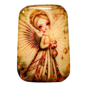 May include: A rectangular, decorative angel image with a vintage aesthetic. The angel has blonde hair, large eyes, and is wearing a long, flowing dress. She holds a lit candle and a lantern. The image has a warm color palette with red and gold accents.