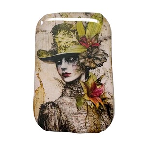 May include: A rectangular decorative piece featuring a vintage-style illustration of a woman wearing a hat adorned with flowers. The woman has dark eye makeup and red lipstick. The color palette includes greens, browns, and reds.