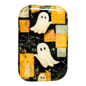 May include: Rectangular Halloween-themed decorative tray with a glossy finish. The tray features a black background with vintage-style postage stamps in orange and green. Two cartoon ghosts and spiderwebs are also visible.