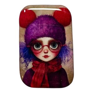 May include: A rectangular decorative piece featuring a whimsical illustration of a girl. She wears a purple hat with red pom-poms, red-framed glasses, and a red scarf. Her hair is blue, and she has a fair complexion.