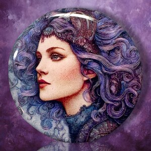 May include: A circular pinback button featuring a detailed illustration of a person in profile with voluminous, wavy purple hair and a decorative headpiece. The artwork uses shades of blue, purple, and soft skin tones to depict the subject.