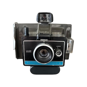 Appareil photo vintage Polaroid SX-70 Land avec étui en cuir d'origine - Reflex argentique classique
