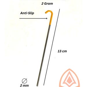 May include: A single titanium tent peg with an anti-slip design. The peg is 13 cm long, 2 mm in diameter, and weighs 2 grams. The top is yellow, and the body is silver. The text "Titanium Tent Pegs" is at the top.