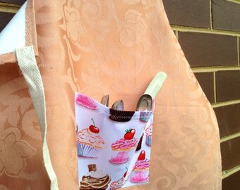 Child's full kitchen or craft apron, waterproof, with large front pocket.