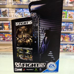 May include: A vertical promotional display for the video game Def Jam: Fight for NY. The graphic features a dark urban scene with a person in a hoodie, a close-up of hands holding a city skyline, and the game title with EA Games and console logos.