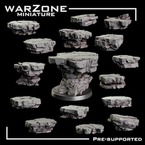 May include: A collection of grey, rock-textured miniature terrain bases for tabletop gaming. The set includes various jagged, stone-like platforms with a central piece mounted on a circular base. The text WARZONE MINIATURE PRE-SUPPORTED is visible.