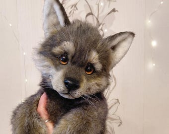 Realistic toy wolf cub