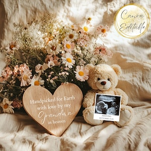 May include: A beige teddy bear, ultrasound image, and wooden heart are arranged with flowers on a beige surface. The heart reads "Handpicked for Earth with love by my Grandma in heaven." The ultrasound image says "Arriving October 202X."